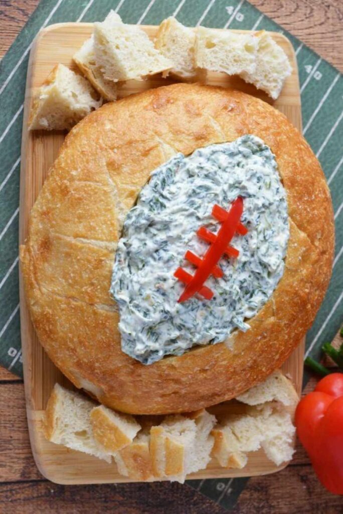 Football Shaped Bread Bowl With Spinach Dip-Game Day Appetizers and Dips for Football Parties